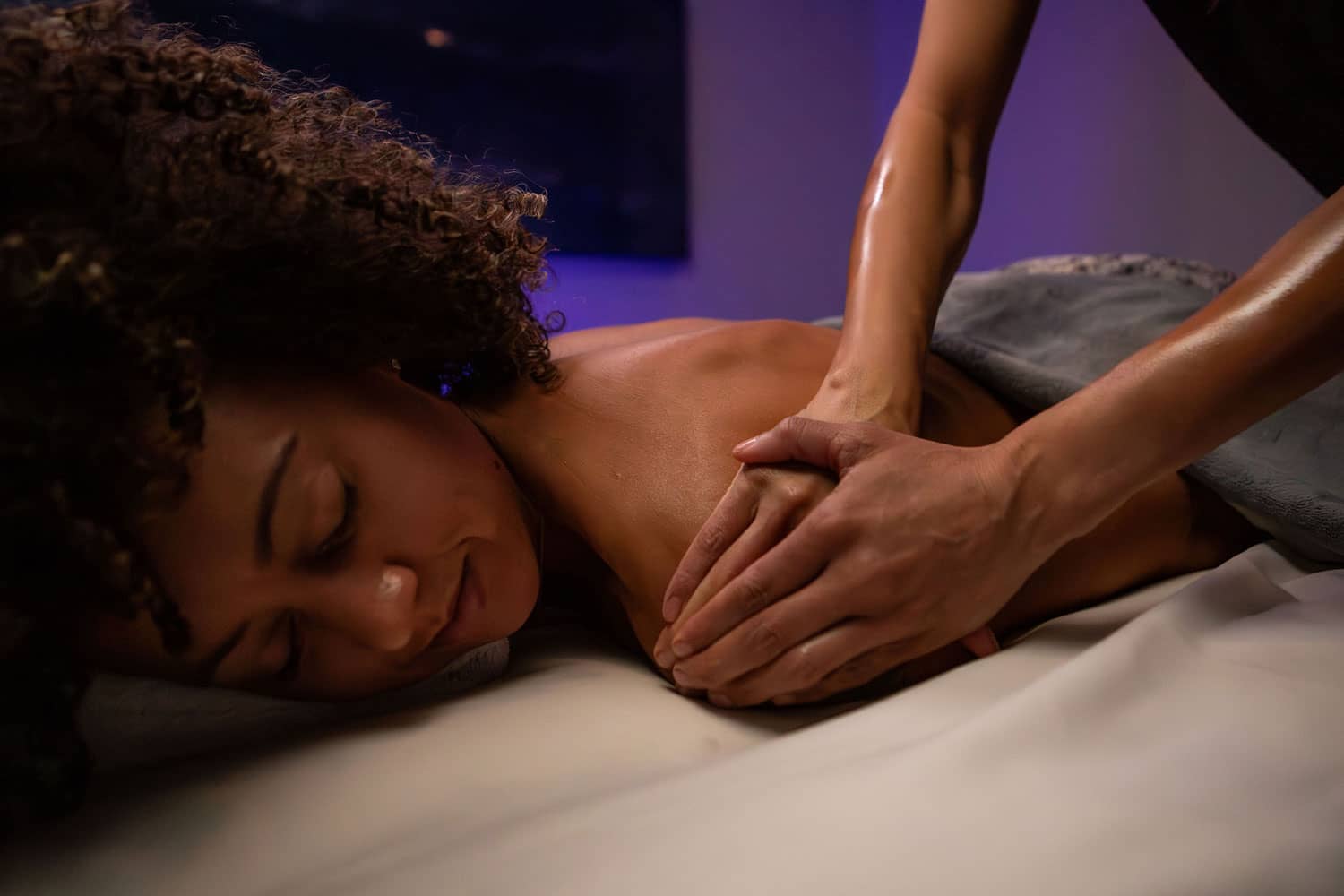 A woman on a massage table at the SeaHill Spa