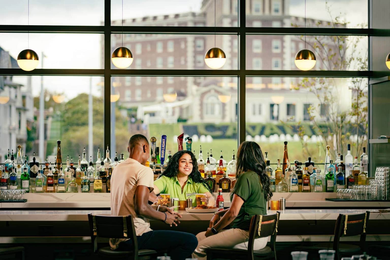 A couple dining at the bar of the Arbuckle's Bar & Grill