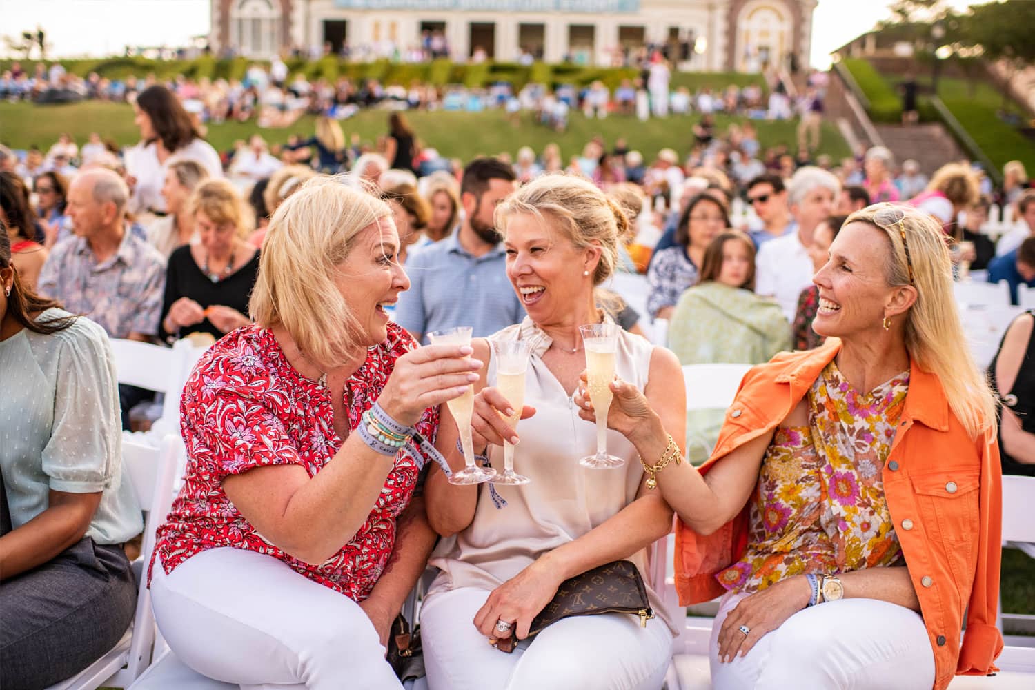 Ladies enjoying Symphony on the Lawn at the Cavalier Resort