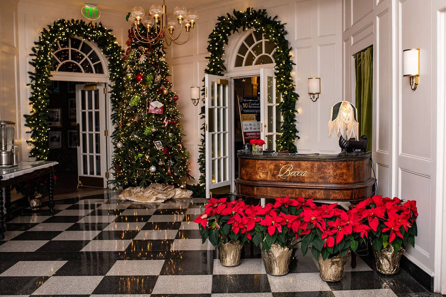The entrance to a restaurant inside a hotel during the holidays