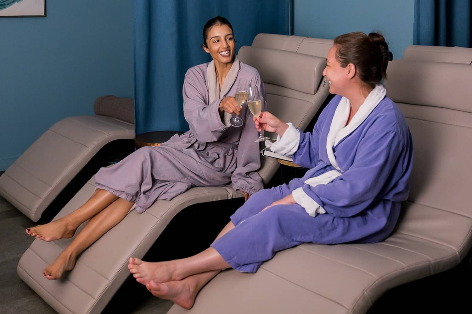 Two women enjoying a massage and spa services at SeaHill Spa.