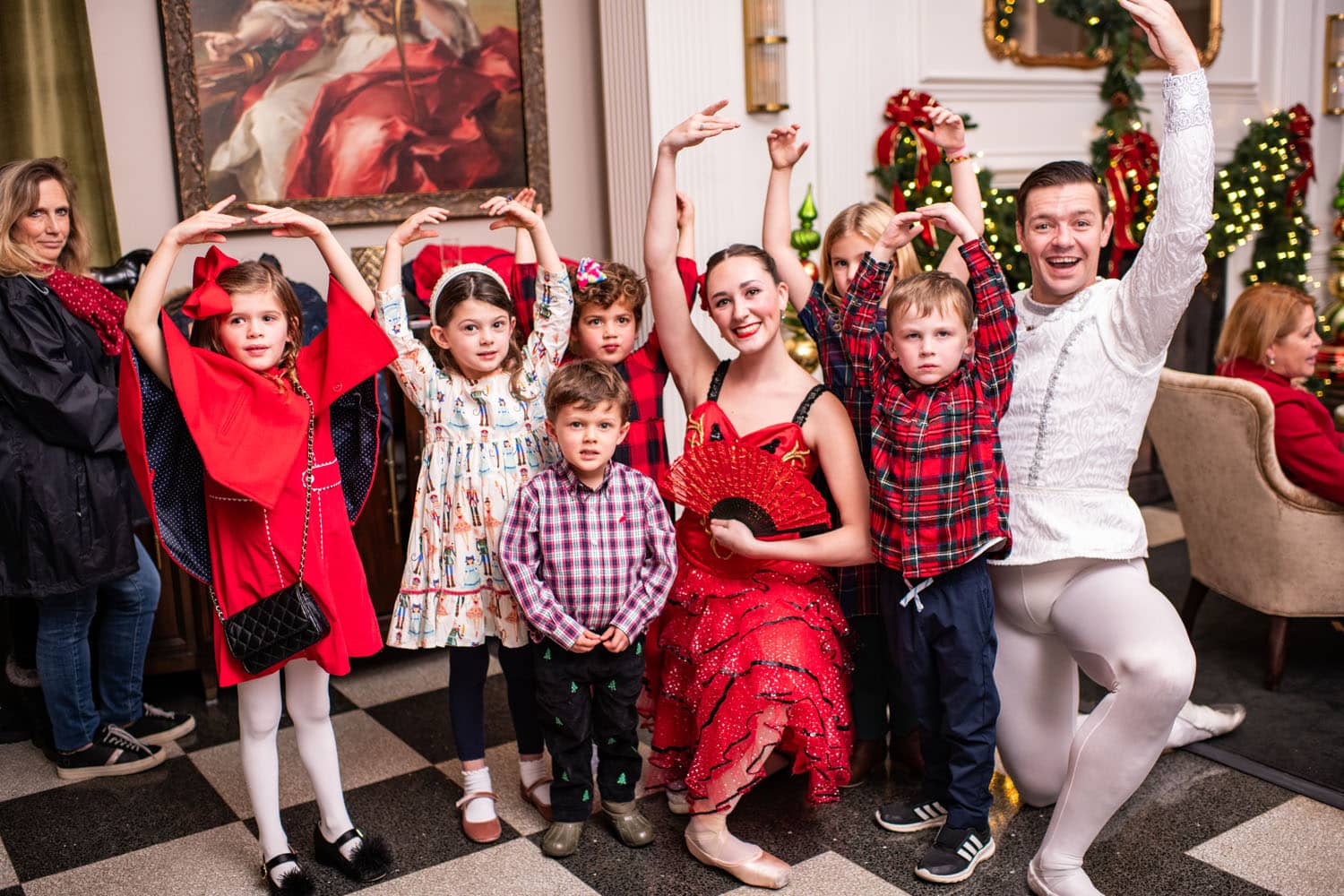 Children posing with ballerina dancers
