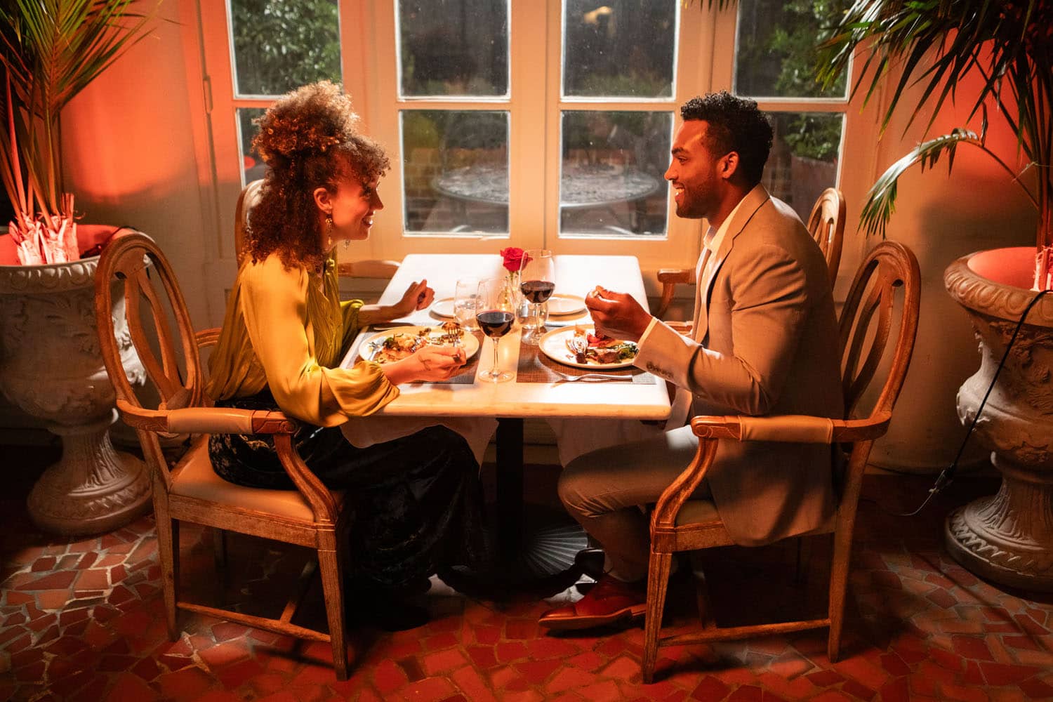 A couple eating dinner together at Becca Restaurant & Garden