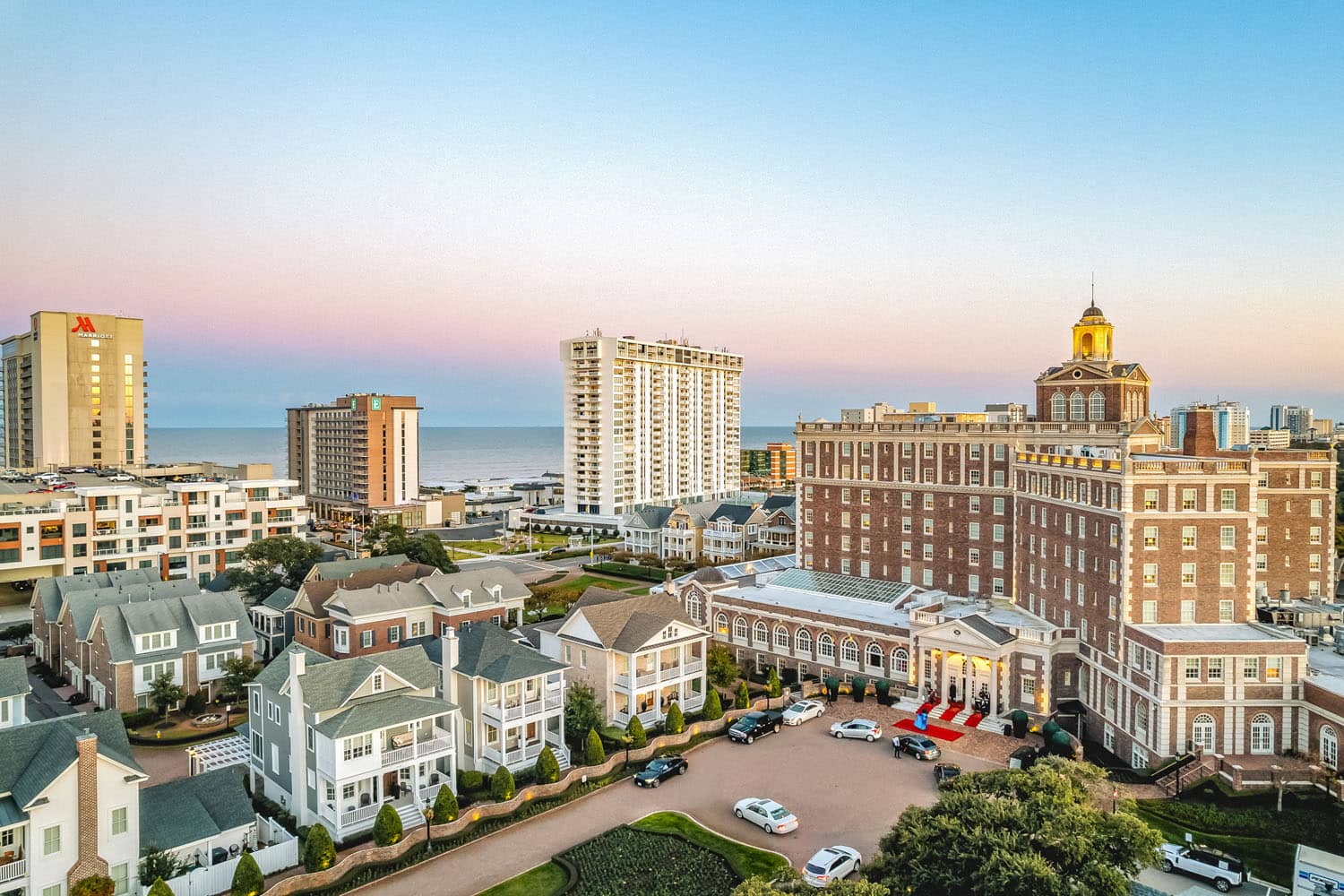 An aerial image of the Cavalier Resort Virginia Beach at dusk