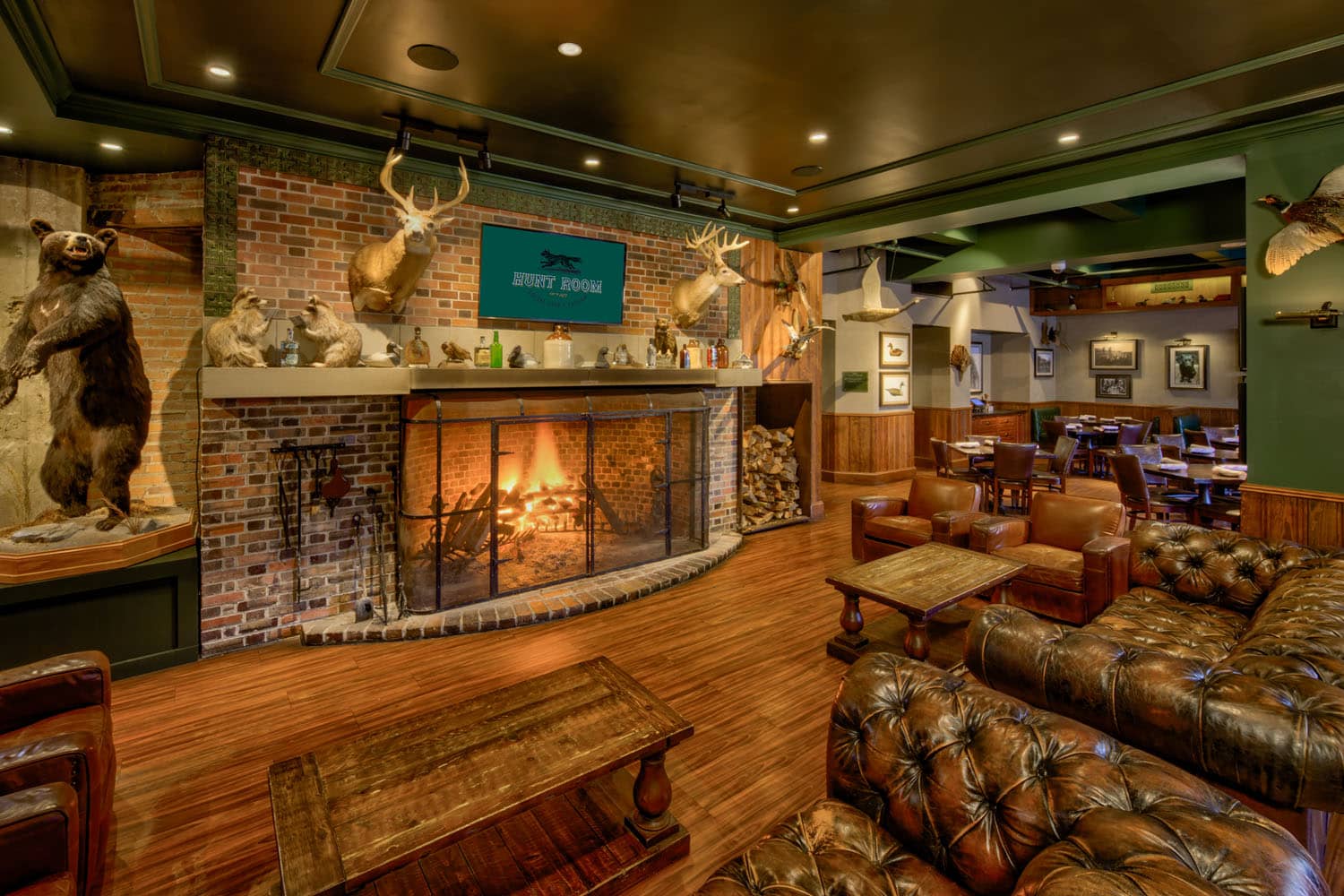 The interior dining room with a fireplace at the Hunt Room