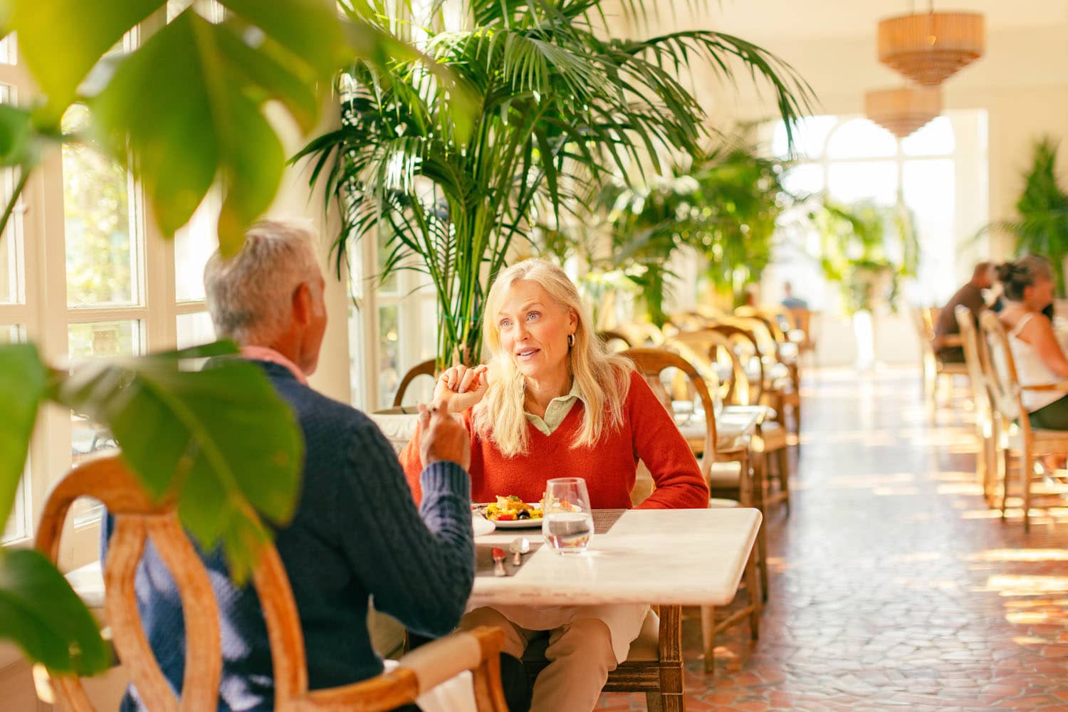 A couple eating dinner inside Becca Restaurant & Garden