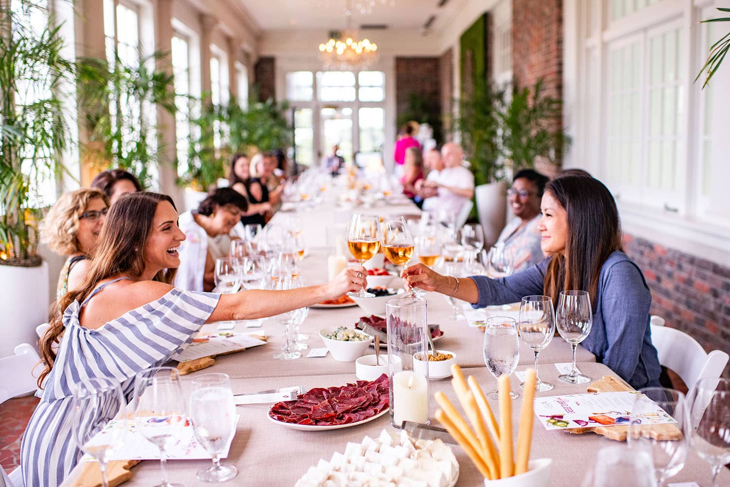 A group of women drinking wine and celebrating