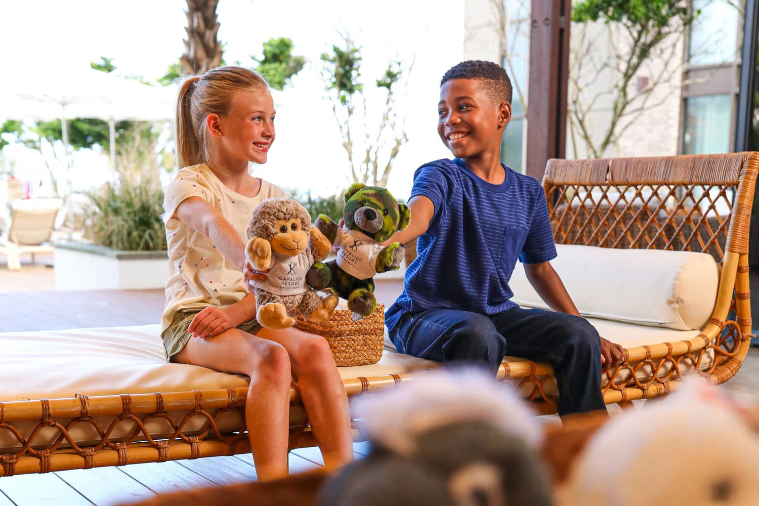 Two kids holding teddy bears