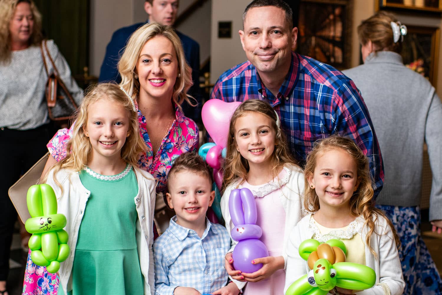 A family posing for a photo at an Easter Event