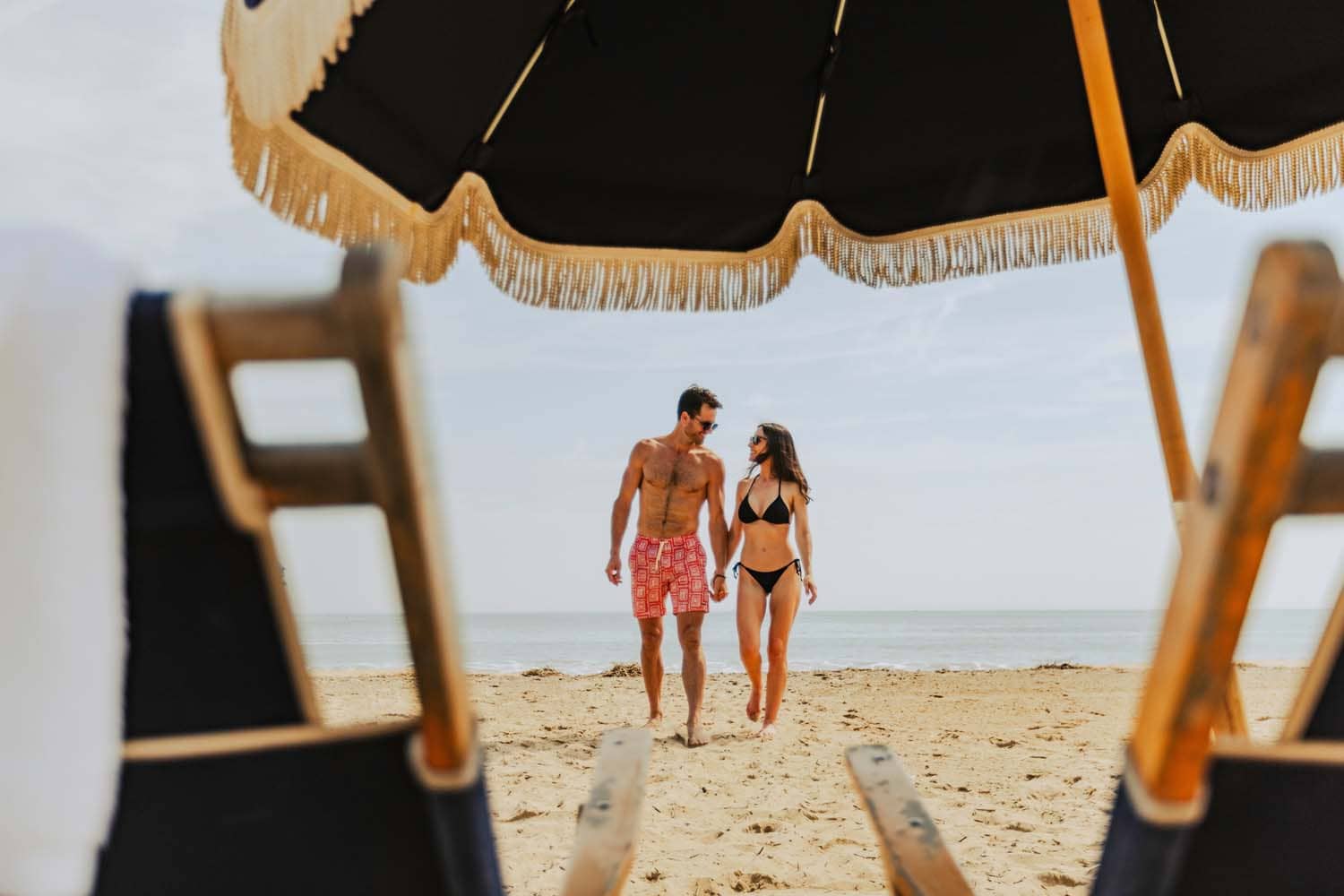 A couple on the semi-private beach outside of the Cavalier Beach Club