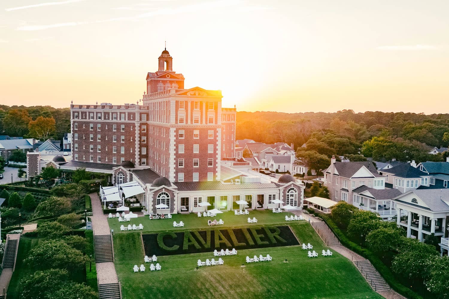 An exterior aerial image of The Historic Cavalier Hotel during sunrise