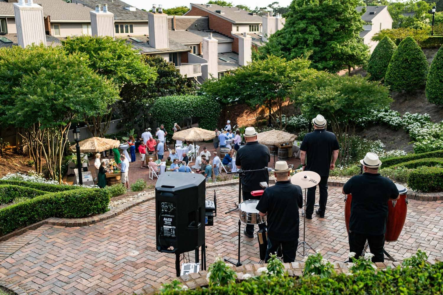 An outdoor event with live music and drinks in the gardens of The Historic Cavalier Hotel