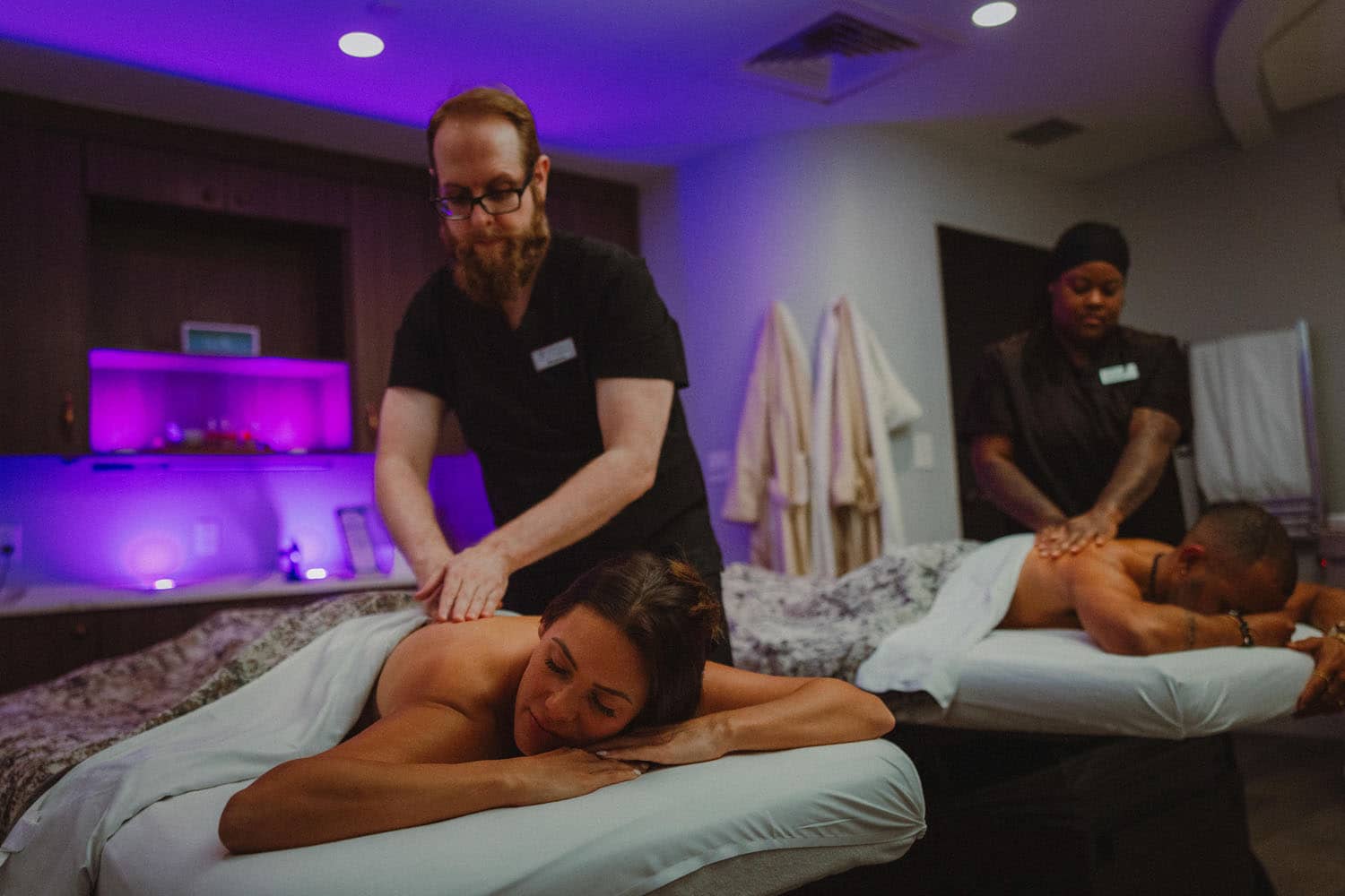A couple enjoying a massage inside the SeaHill Spa