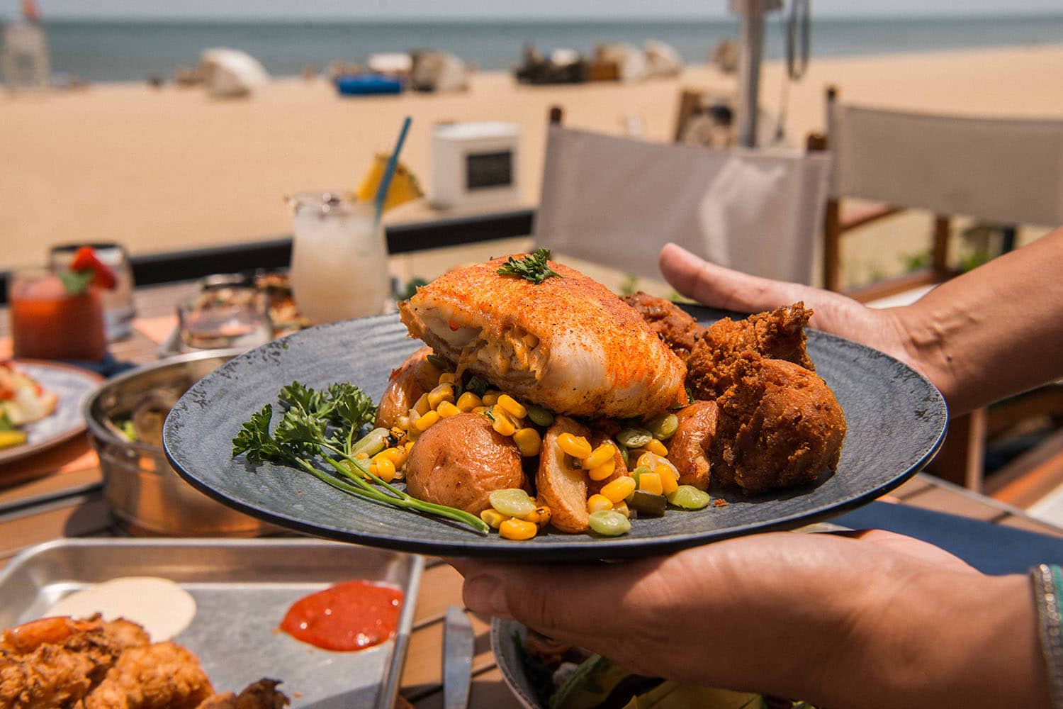 A plated seafood meal at The Deck Seagrill & Bar restaurant