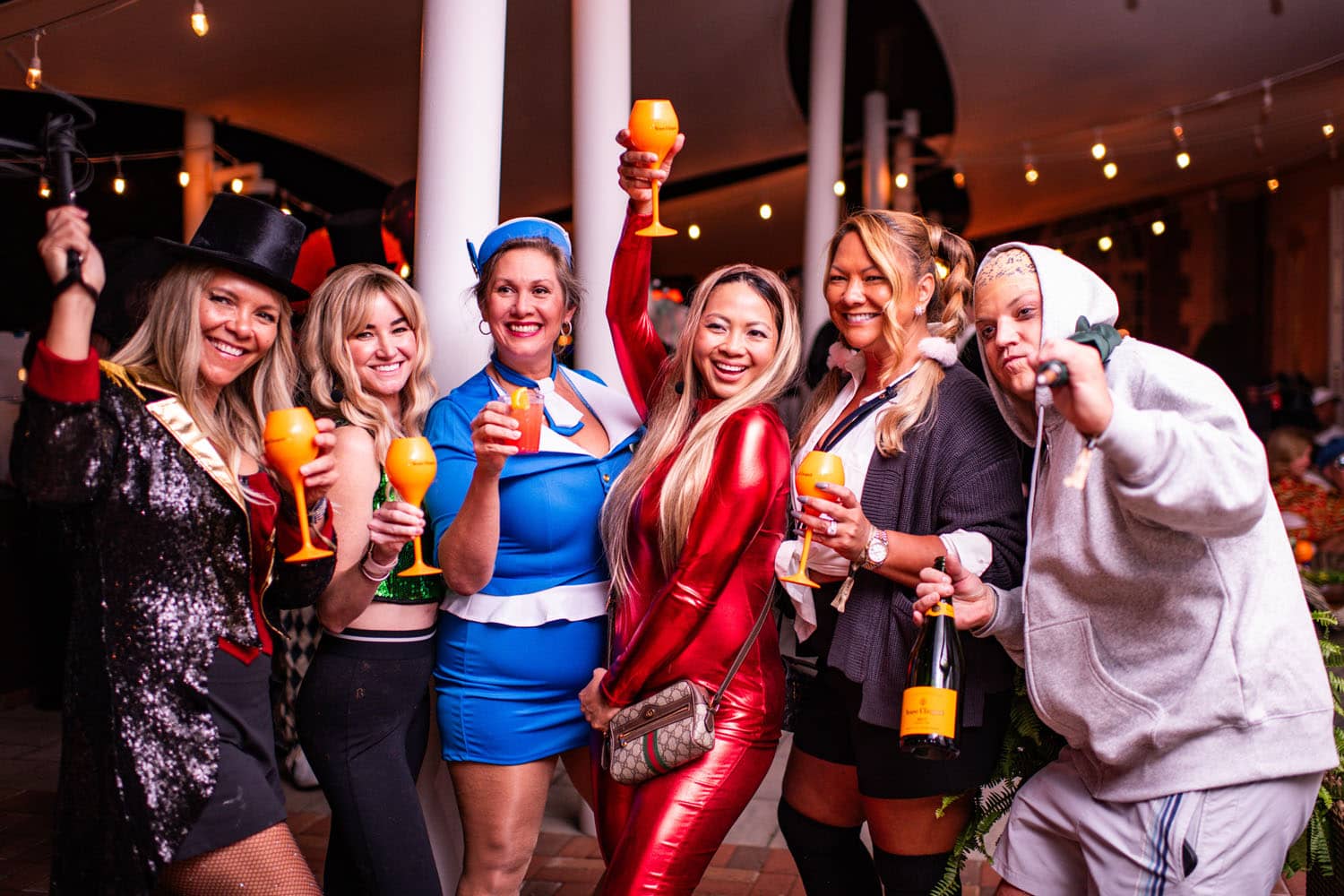 A group of people posing for a photo at a Halloween event