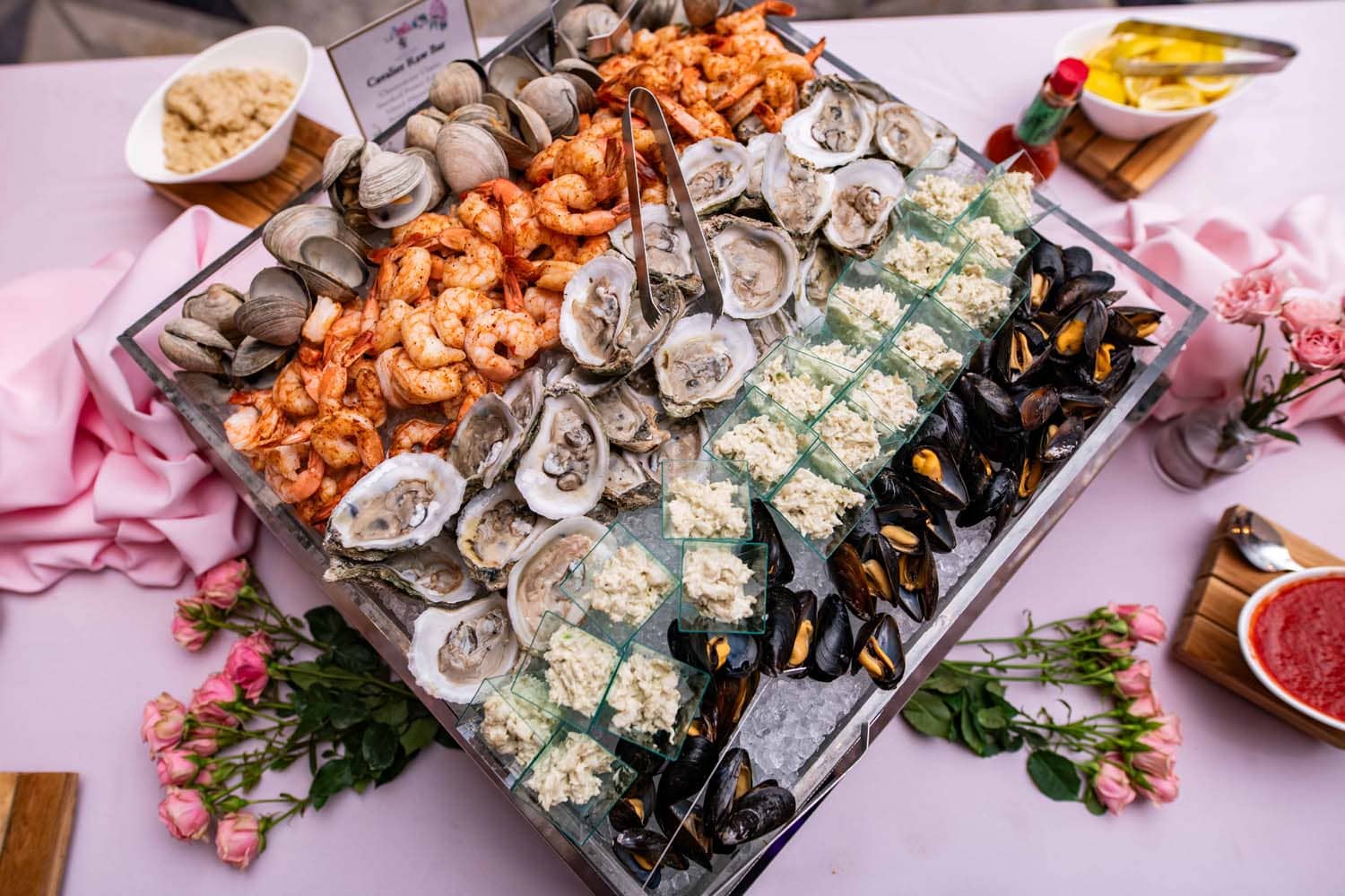 A buffet platter featuring fresh seafood