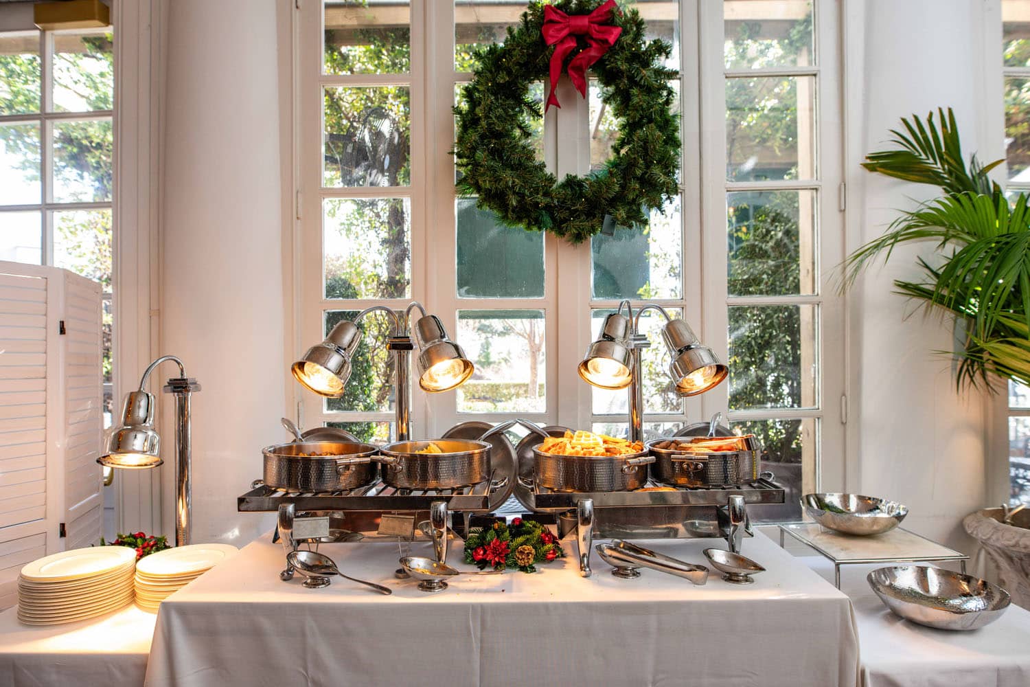 An interior dining table during the holidays inside The Historic Cavalier Hotel