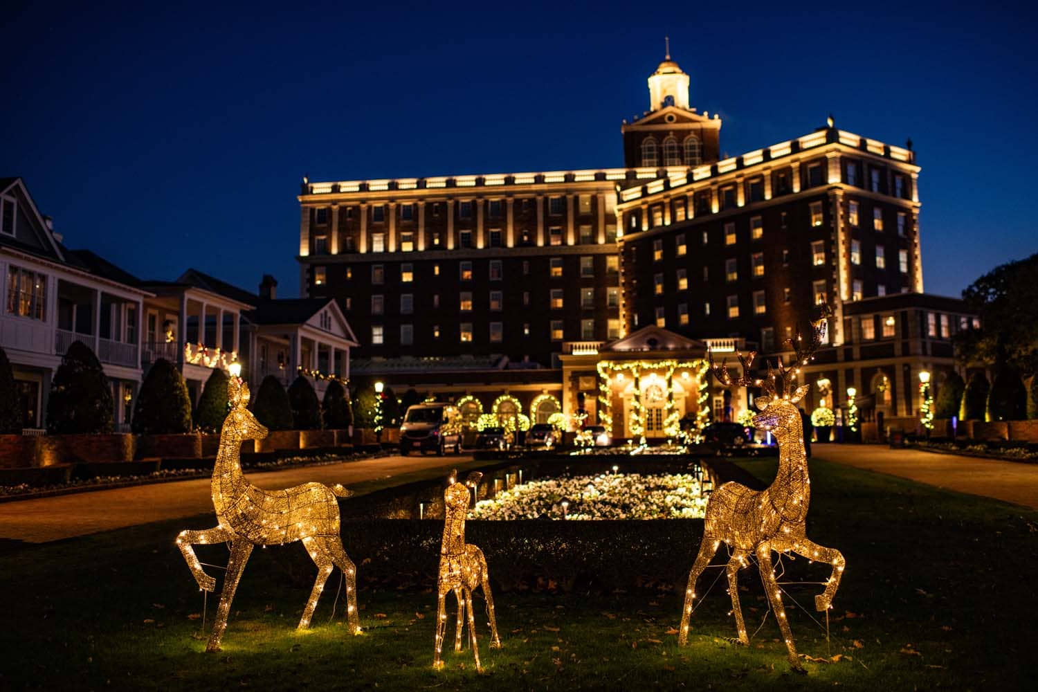 A Santa sleigh and decorative reindeer outside The Historic Cavalier Hotel