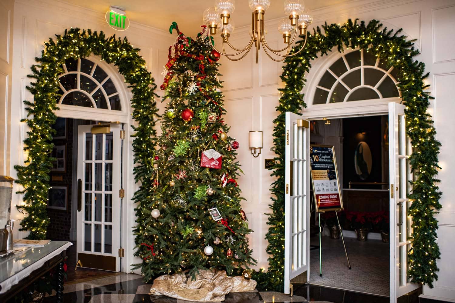 A hotel lobby with a Christmas tree and ornaments