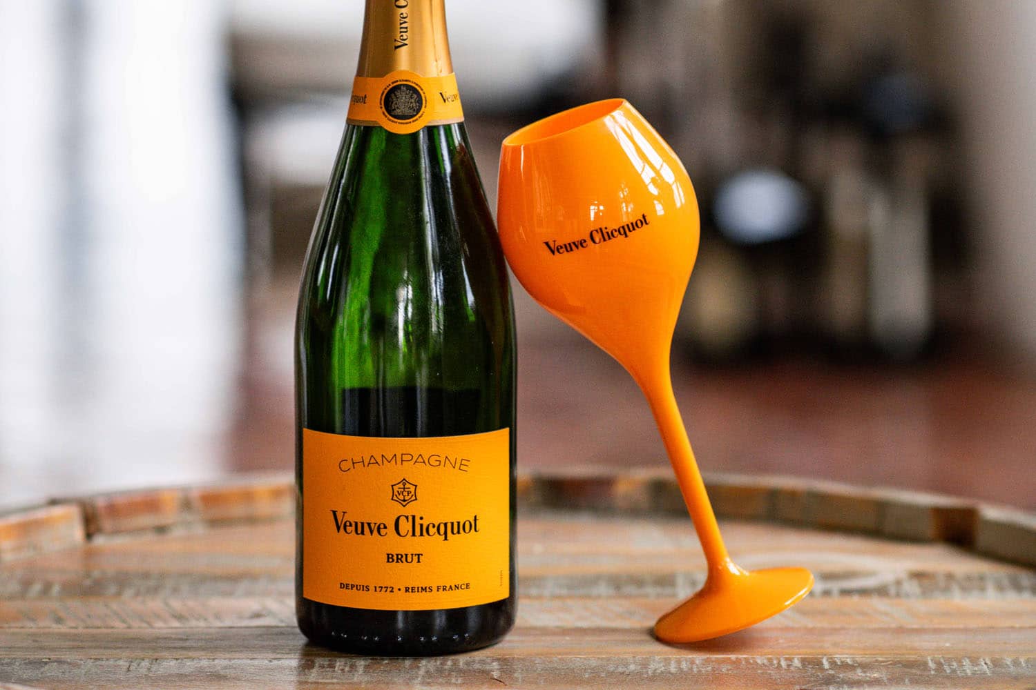 A close up of Veuve Clicquot Champagne bottle with branded cup