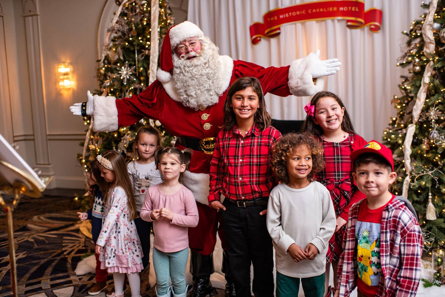 A family posing for a photo with Santa