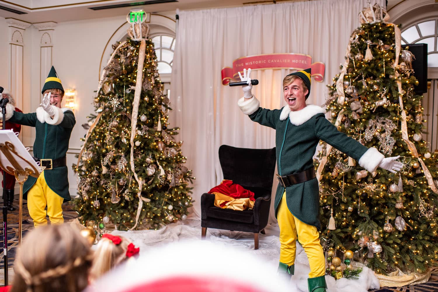 Santa performing a song on a stage