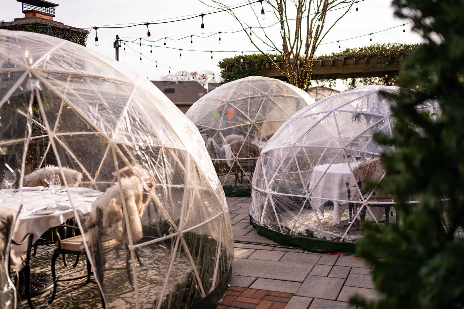 An outdoor heated igloo at Becca Restaurant & Garden