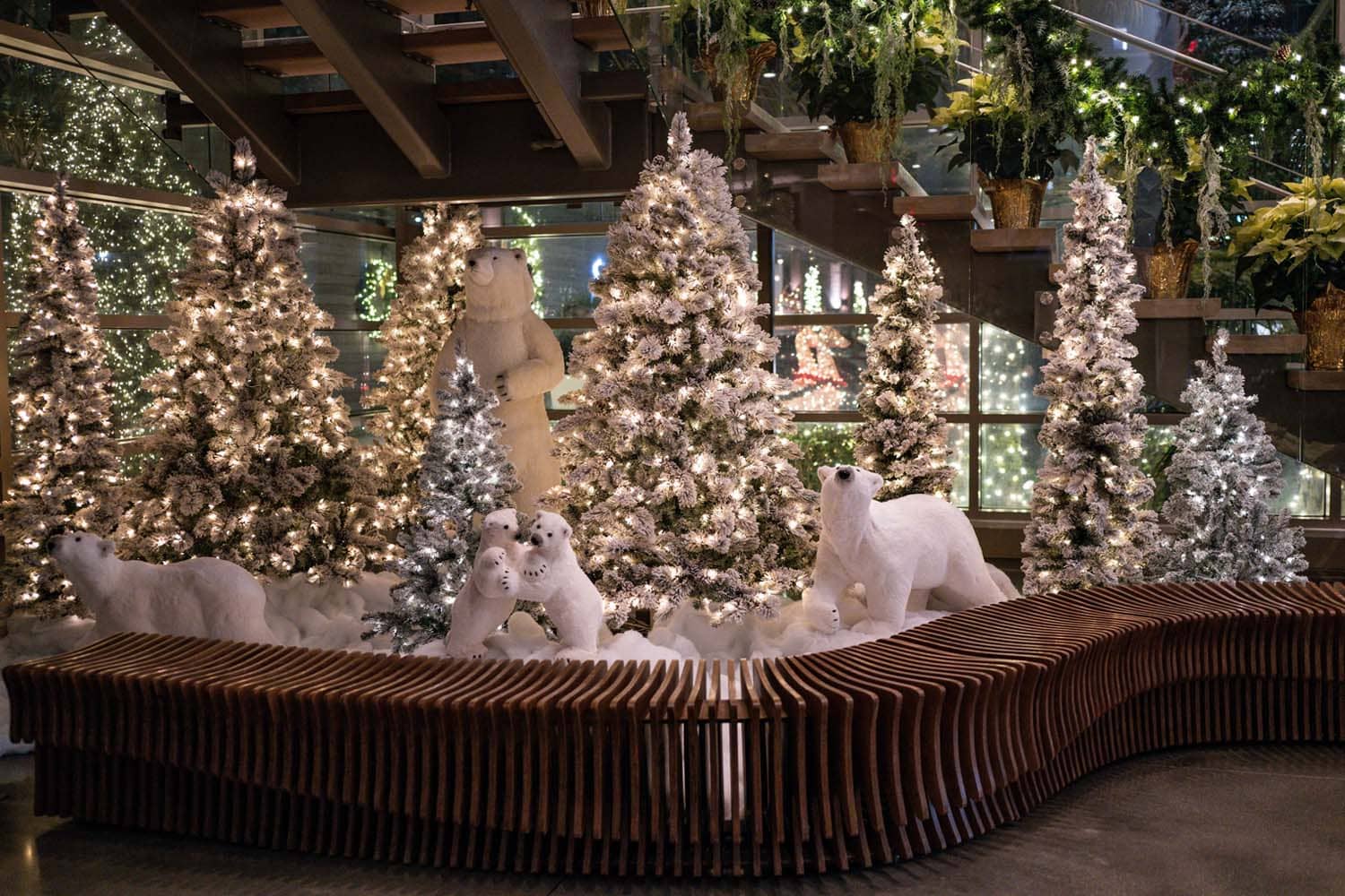 A lobby of a hotel decorated for the holidays