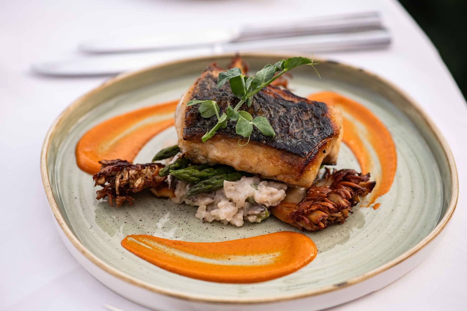 A plated dish from Becca Restaurant & Garden on a table