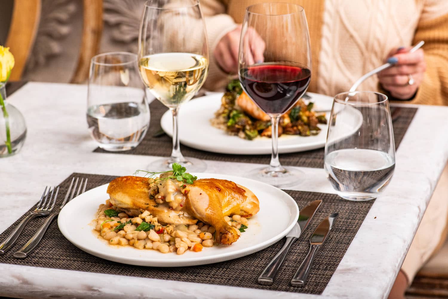 A plated meal on a table at Becca Restaurant & Garden