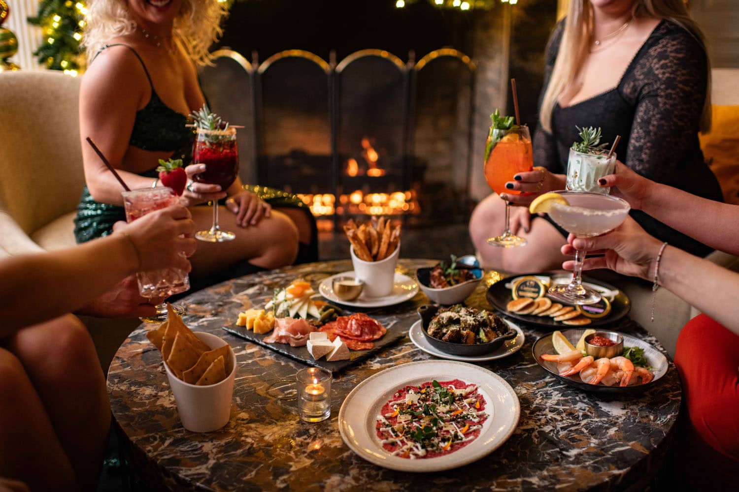 A table with food and drinks on it at The Raleigh Room inside The Cavalier Hotel