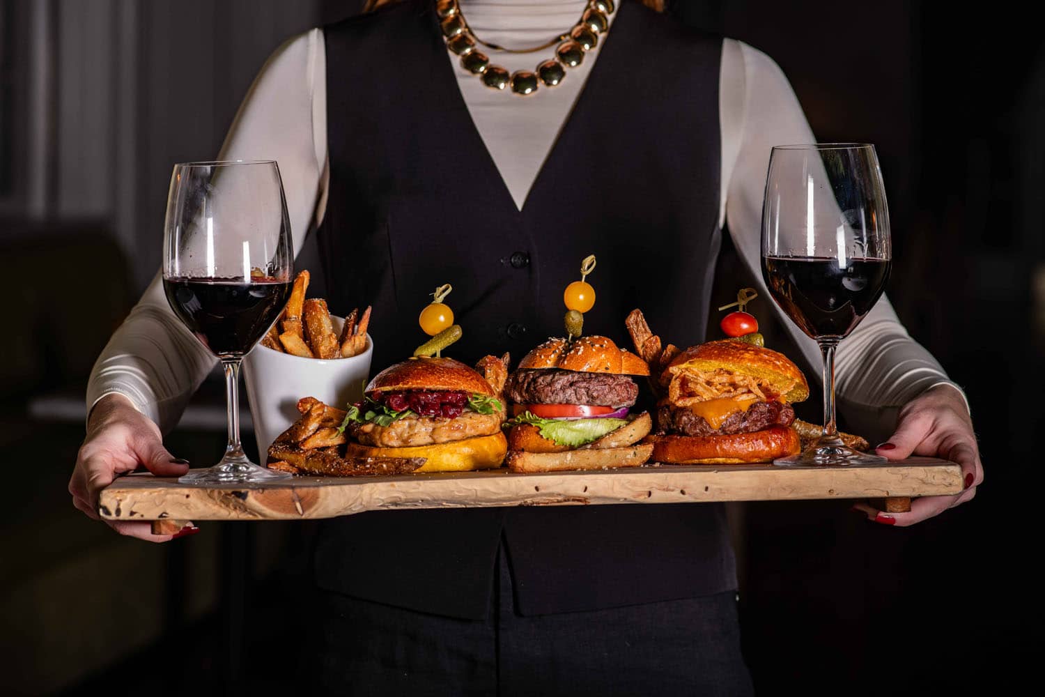 A platter of burgers and wine at Becca Restaurant & Garden