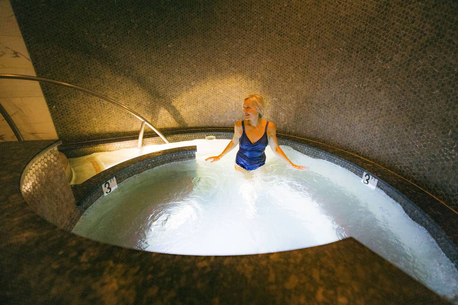 A woman in a spa whirlpool at The Historic Cavalier Hotel