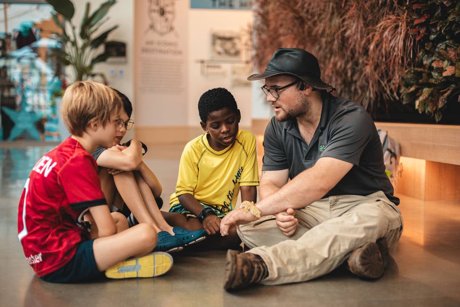 A group of children learning about reptiles during an activity offering at the Cavalier Resort
