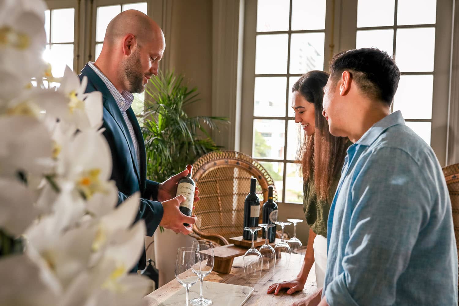 A couple enjoying a wine tasting class at The Historic Cavalier Hotel