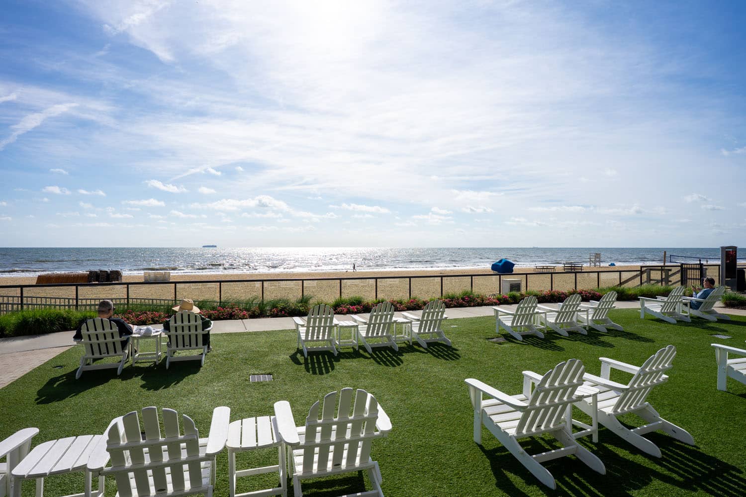 The outdoor lawn and chairs seaside at the Cavalier Resort