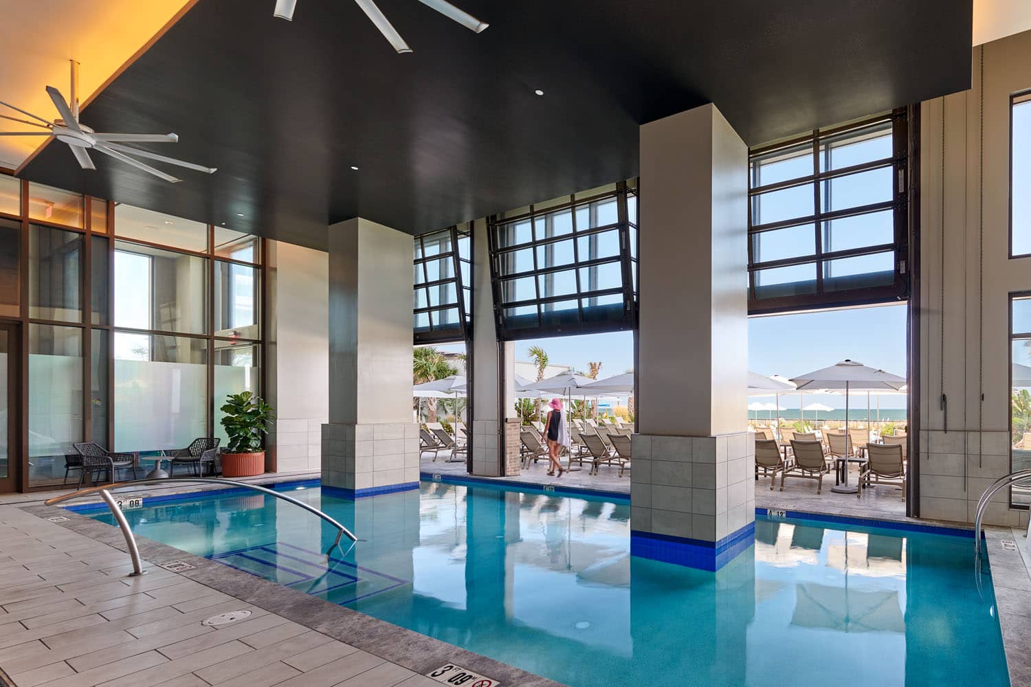 The indoor and outdoor pools and lounge area at the Embassy Suites hotel at the Cavalier Resort