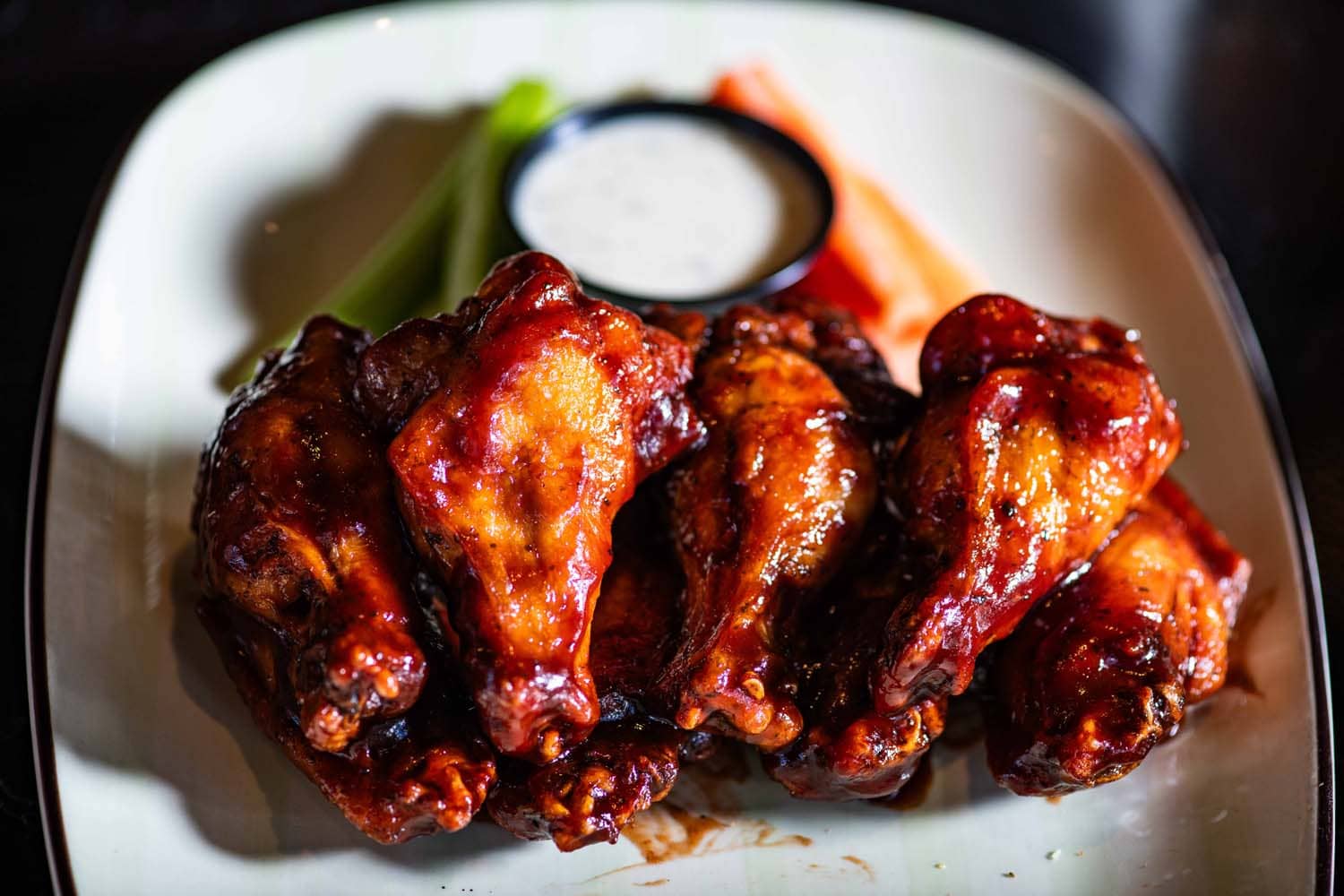 A close-up spread of chicken wings on a table at Arbuckle's Bar & Grill