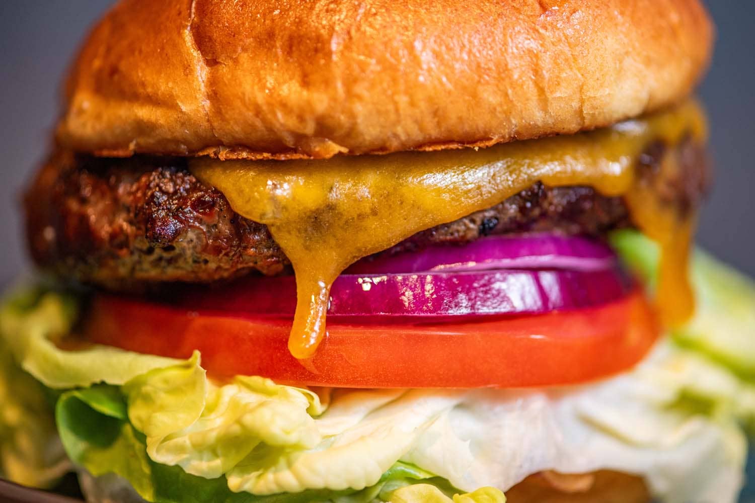 A close-up hamburger on a table at Arbuckle's Bar & Grill