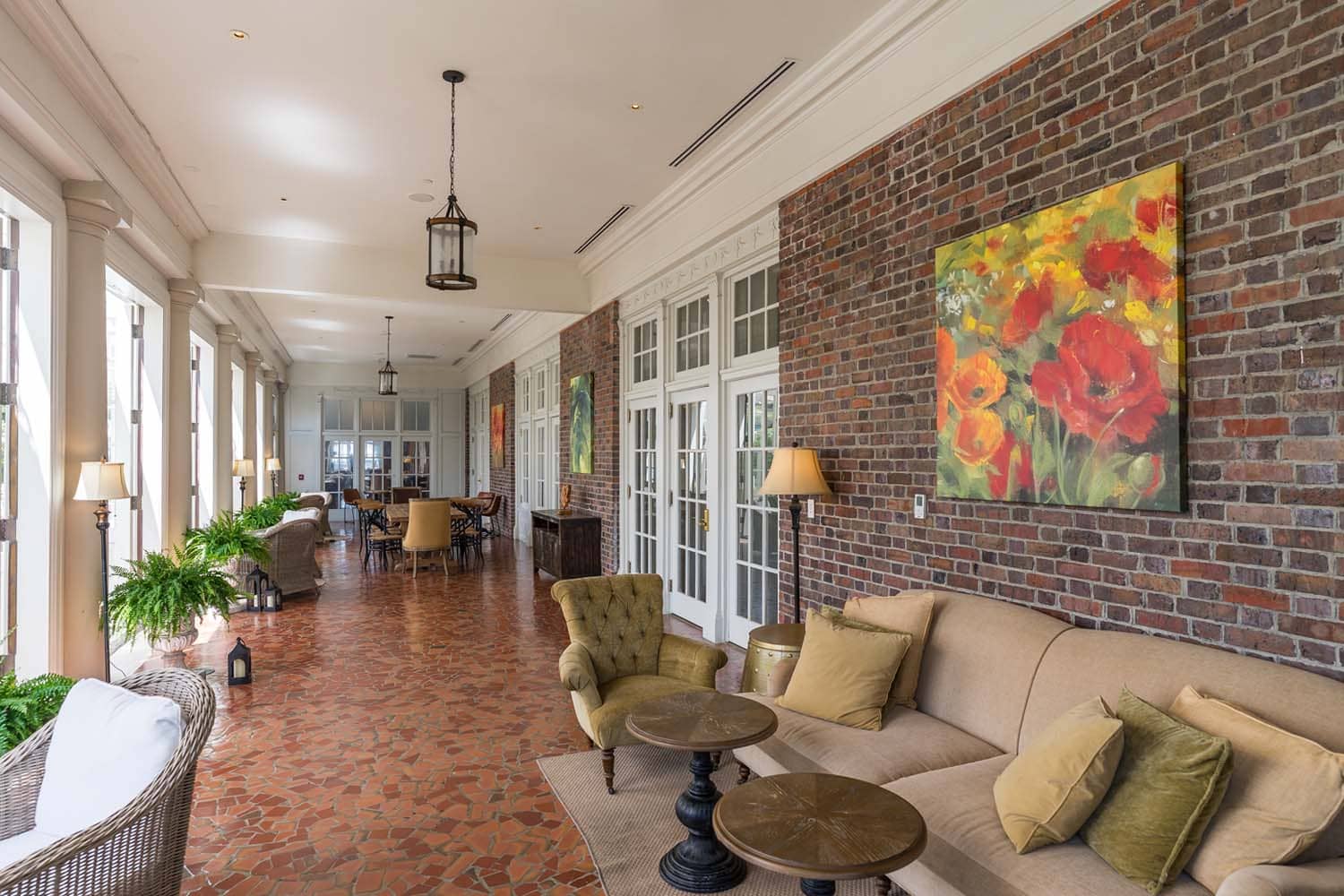 The interior lounge with chairs and couches inside The Raleigh Room