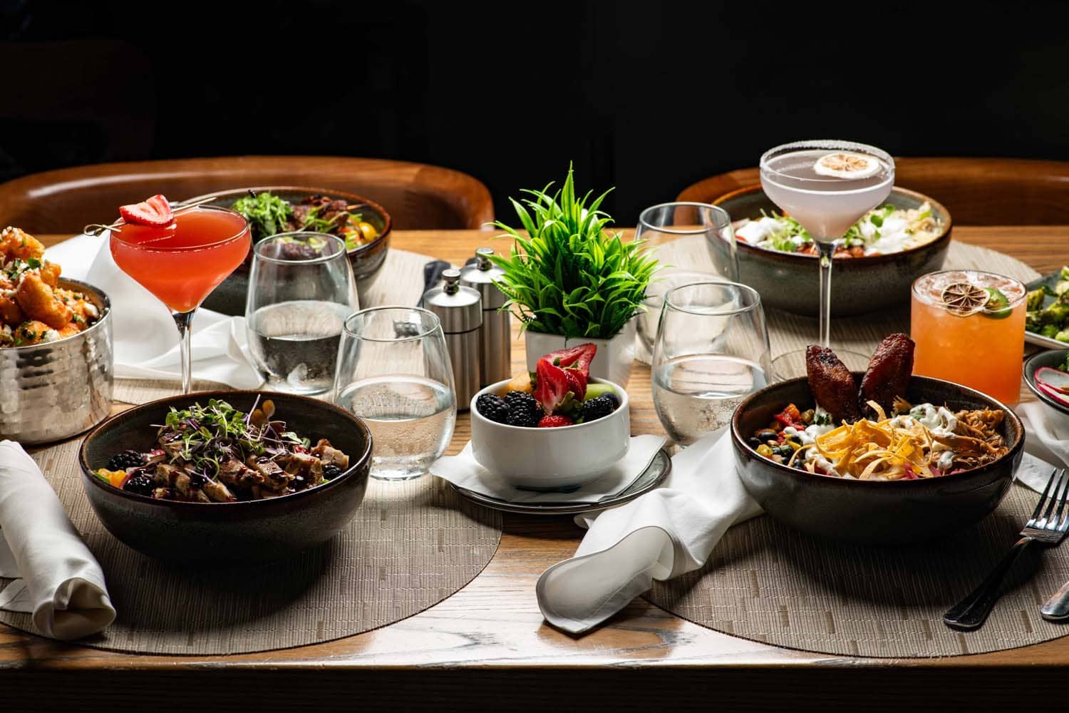 A variety of plated dishes on a table at Tulu Seaside Bar & Grill