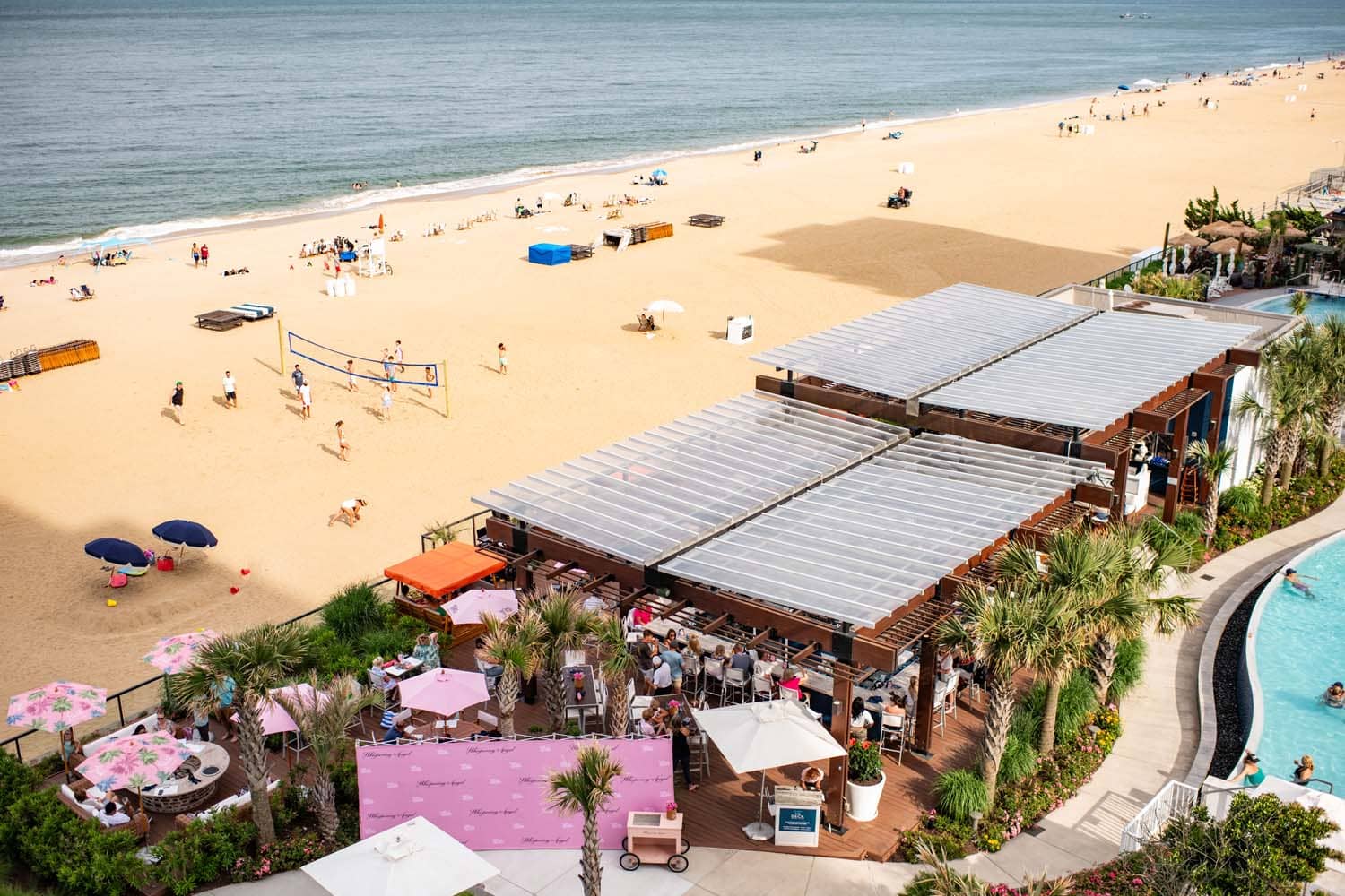 An aerial view of The Deck Seaside Bar & Grill and oceanfront