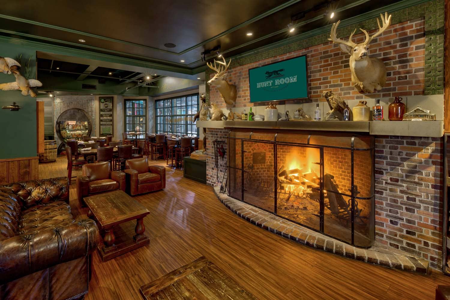 The interior dining room and fireplace inside the Hunt Room
