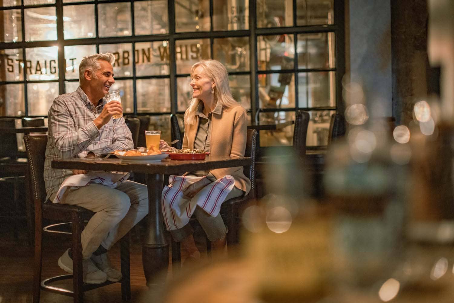 A couple eating dinner inside the Hunt Room restaurant