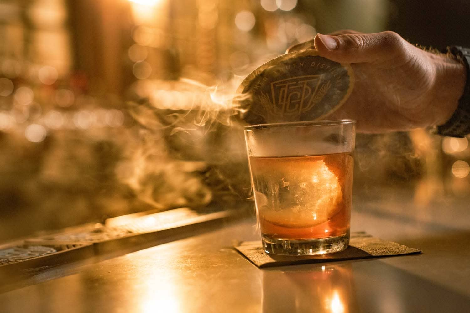 A smoked bourbon cocktail at the bar inside the Hunt Room