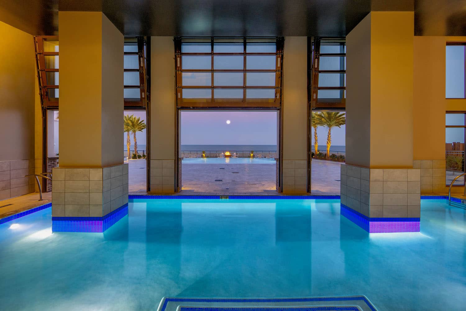 An indoor and outdoor pool at the Embassy Suites Virginia Beach Oceanfront Resort