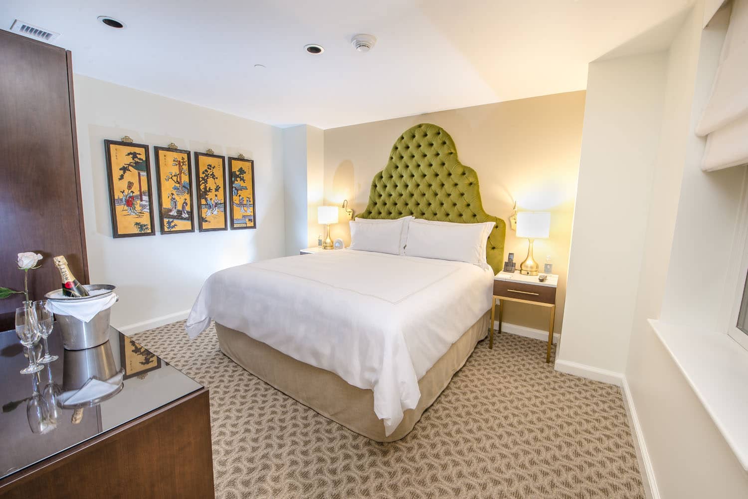A king bedroom suite inside The Historic Cavalier Hotel