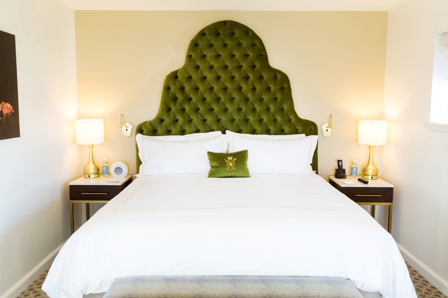 A king bed inside a suite at The Historic Cavalier Hotel