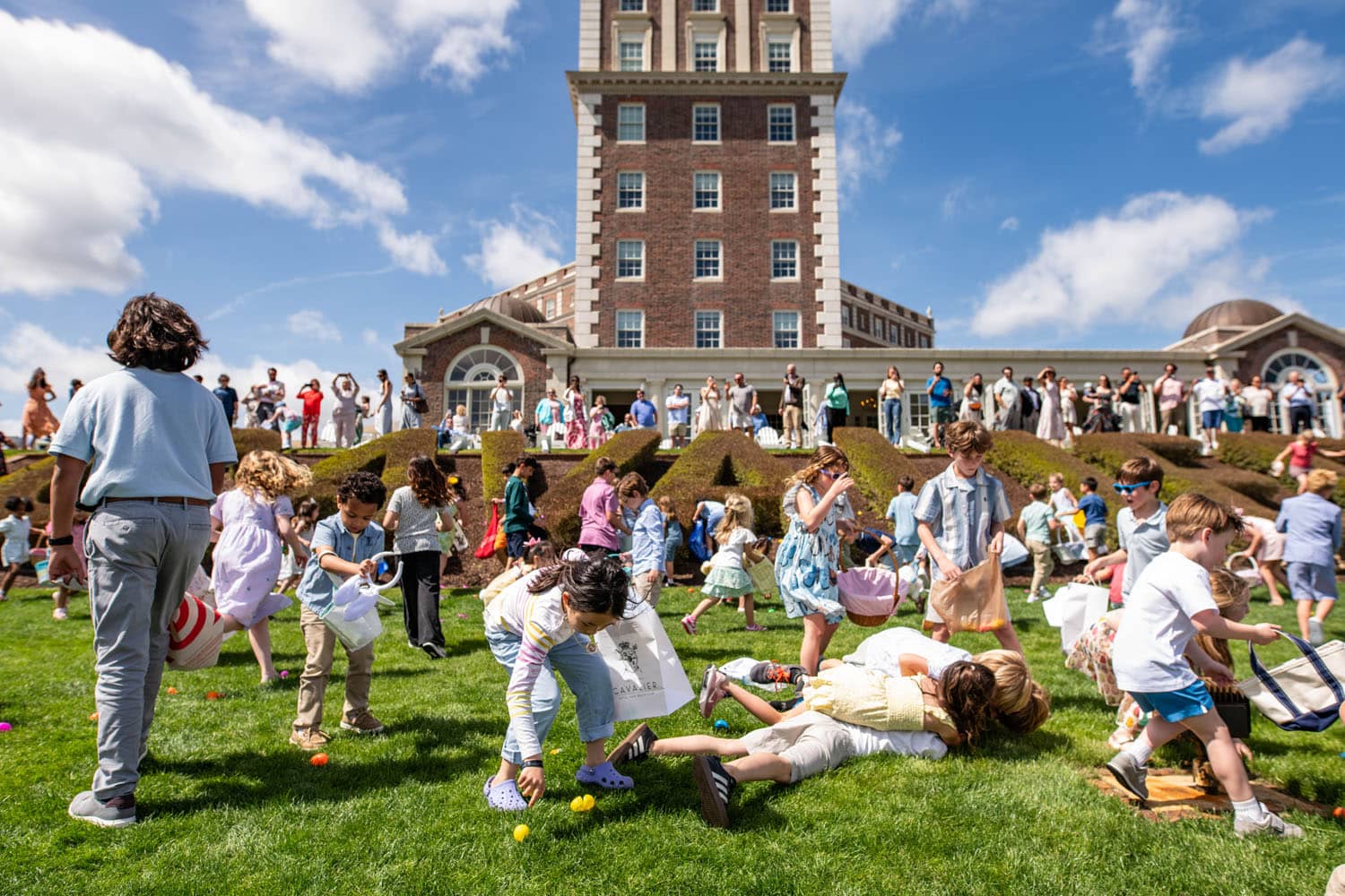 Children searching for Easter eggs on the Great Lawn at The Historic Cavalier Hotel