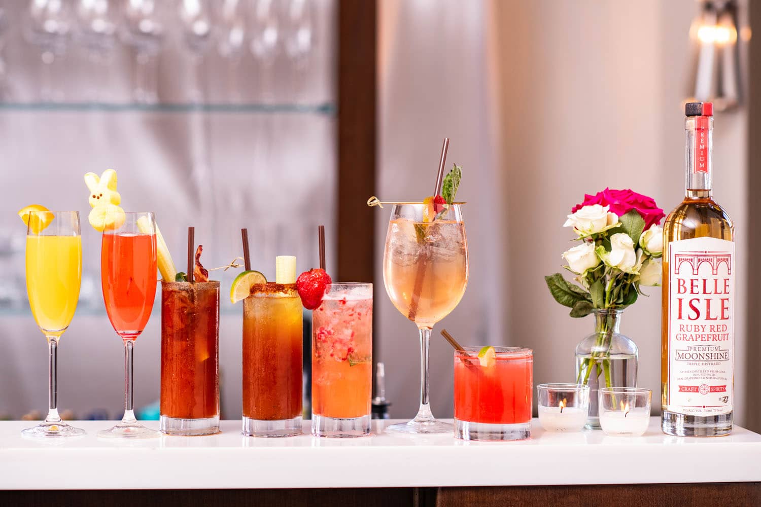 A variety of cocktails on a table inside a holiday brunch at The Cavalier Hotel